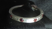 [silver ring with five garnets (size 7.5+)]
