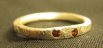 [silver ring with two garnets]